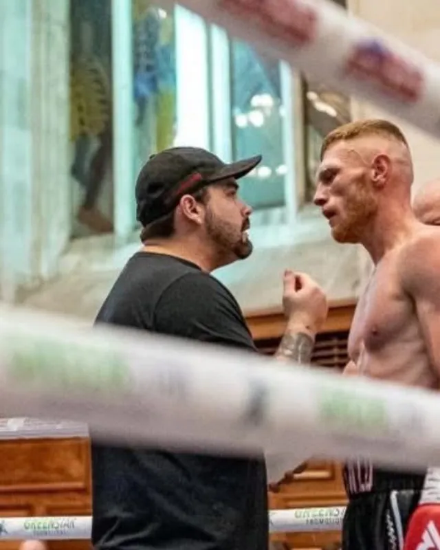 Marlee Dann and Lewis Everson face to face in the corner
