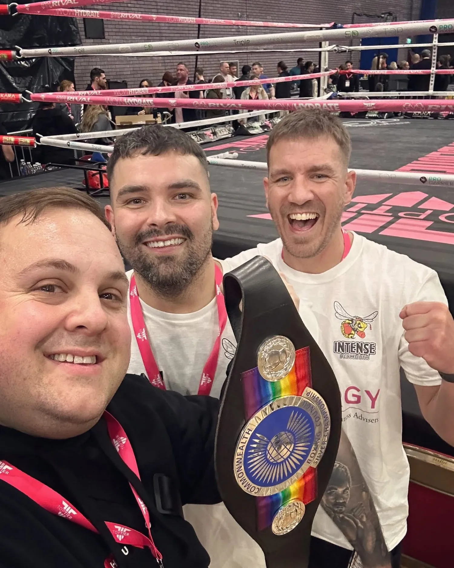 Ringside selfie with a Commonwealth belt, wearing an Intense bee shirt