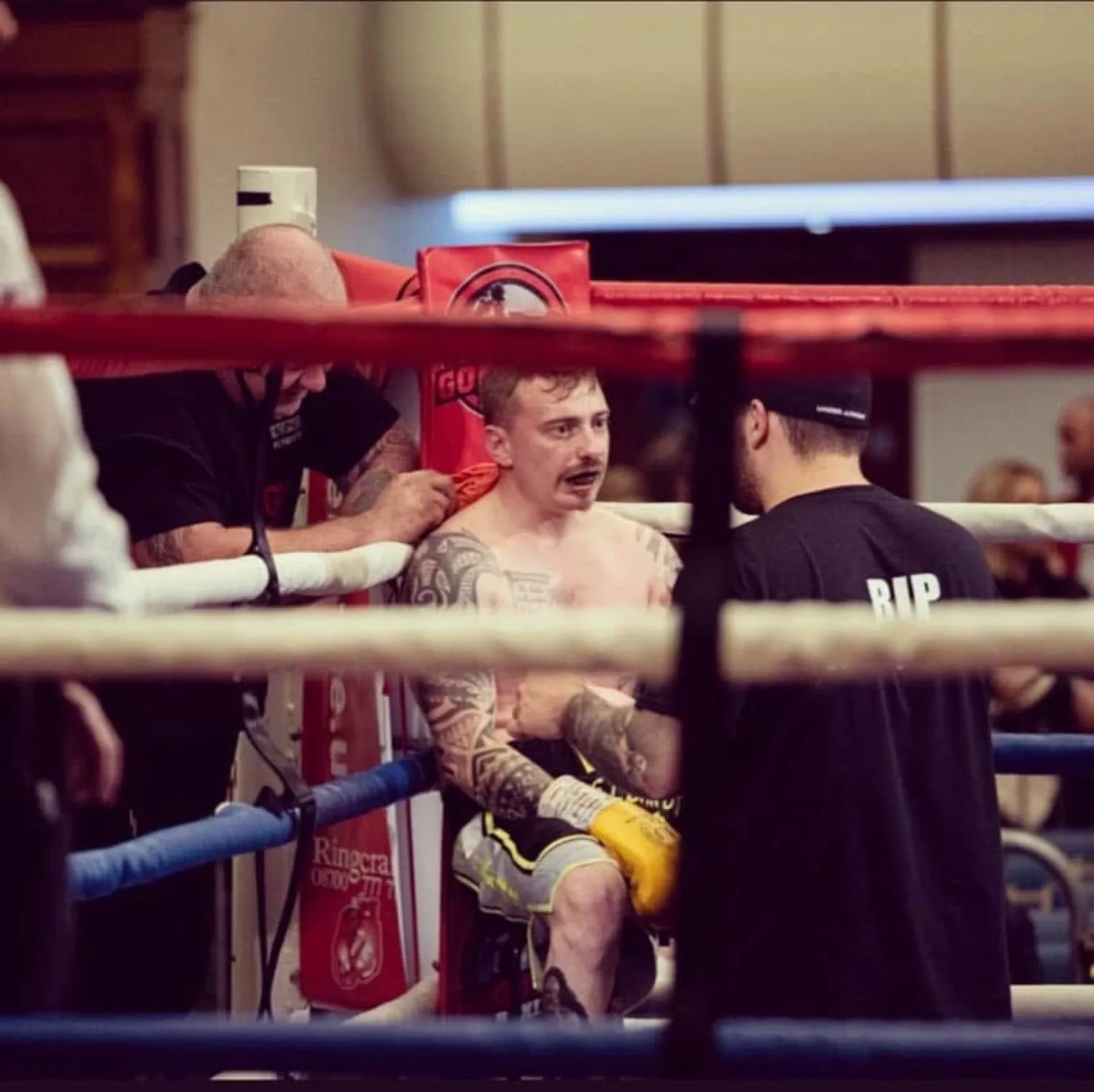 Boxer sitting on the stool in the corner between rounds