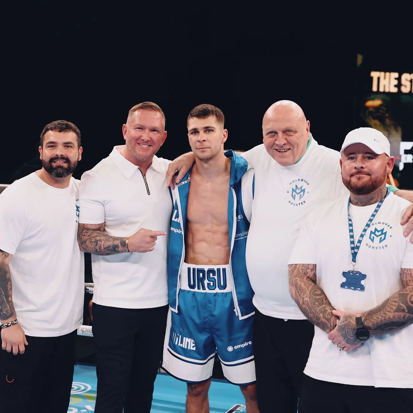 Constantin Ursu in URSU shorts with his team in Moldovan Monster shirts on fight night