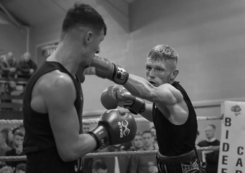 Lewis Everson in an amateur bout, black and white photo