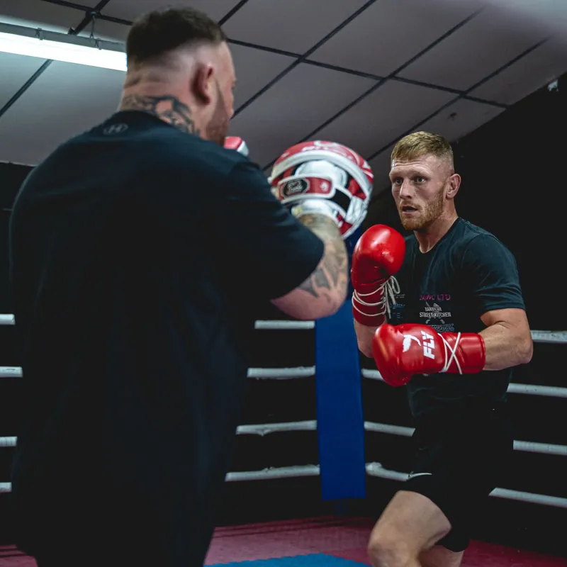 Lewis Everson working the pads in the gym ring