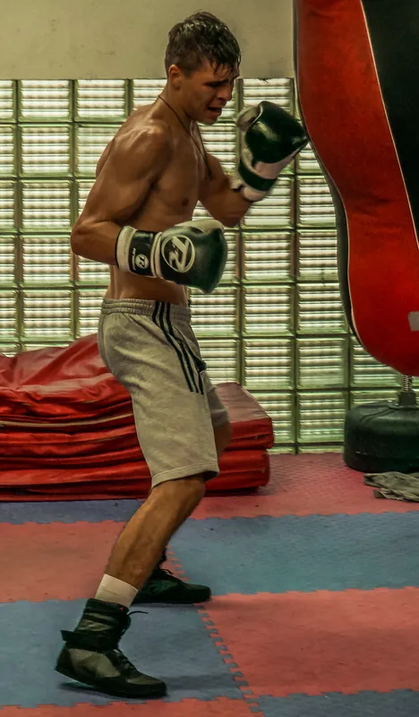 Constantin Ursu working on a heavy bag at Intense Boxing
