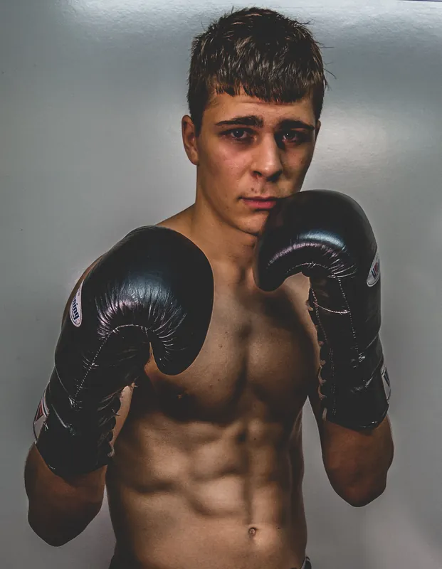 Studio portrait of a young Constantin Ursu with black gloves up