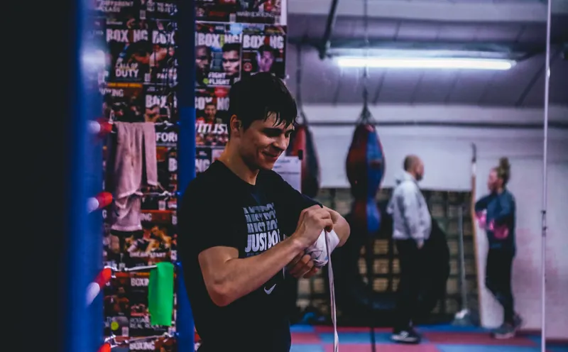 Constantin Ursu wrapping his hands in the gym