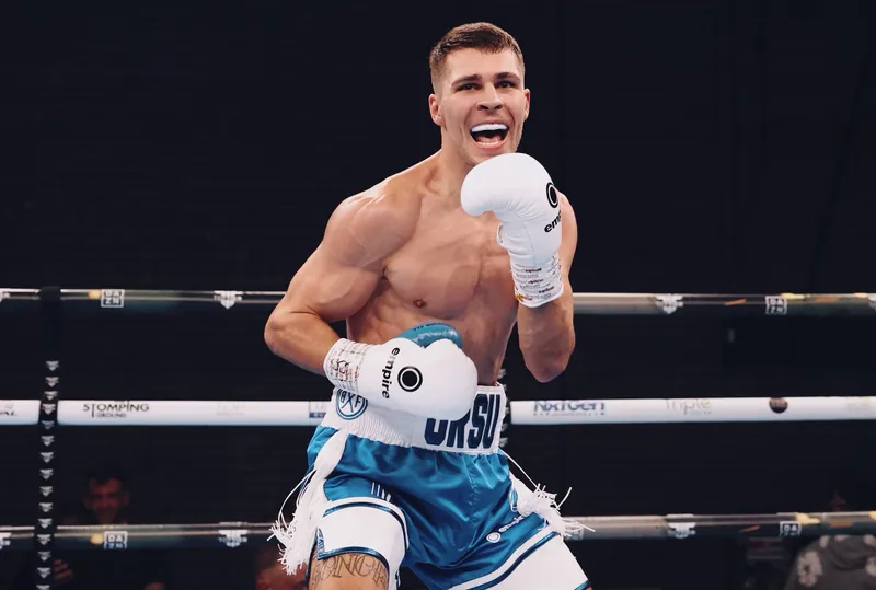 Constantin Ursu celebrating in the ring