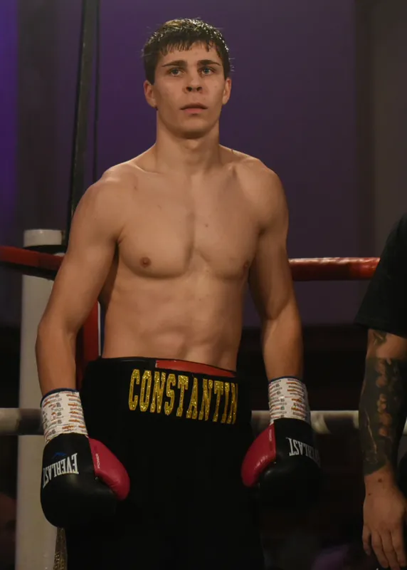 Constantin Ursu in black and gold CONSTANTIN shorts in the ring before his pro debut