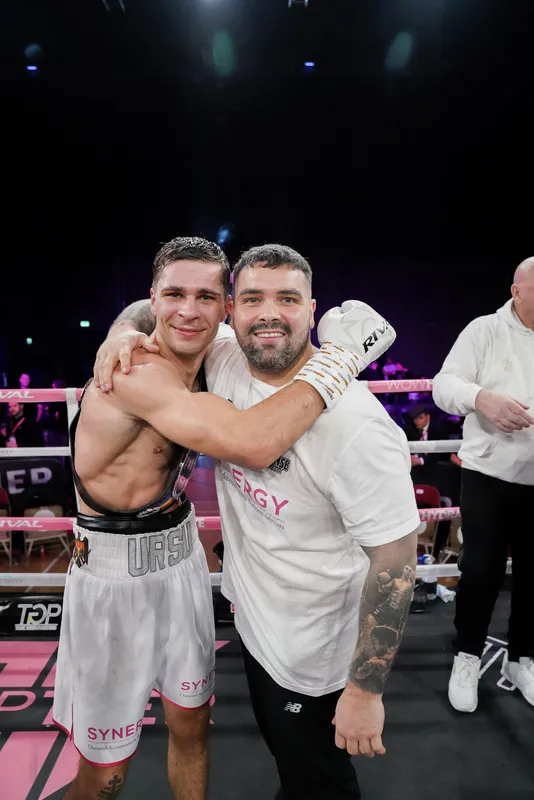 Constantin Ursu embracing Marlee Dann in the ring