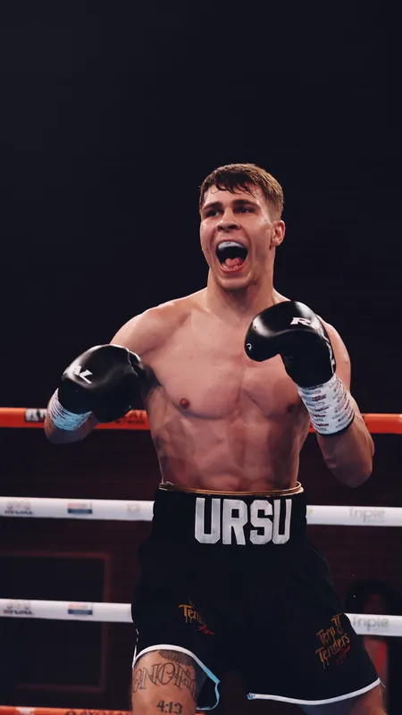 Constantin Ursu roaring in the ring in URSU shorts