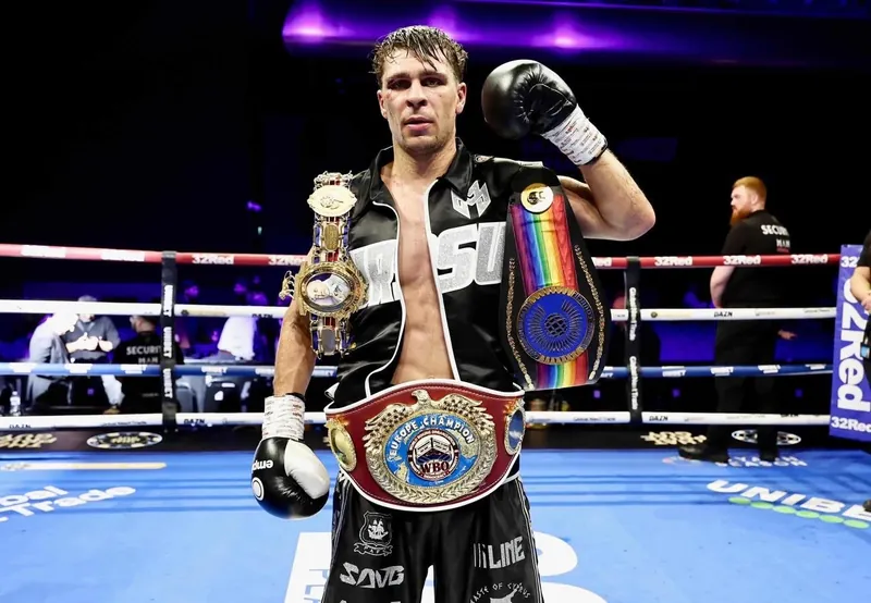 Constantin Ursu with his championship belts in the ring